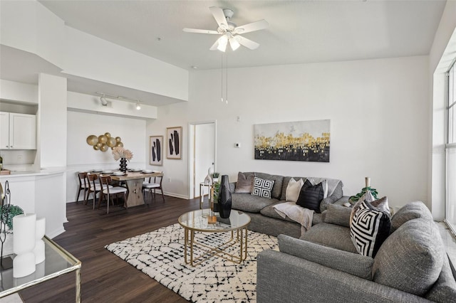 5530 Metrowest Blvd Unit 9-311, Orlando, FL 32811 - living area featuring dark wood finished floors, ceiling fan, track lighting, and baseboards