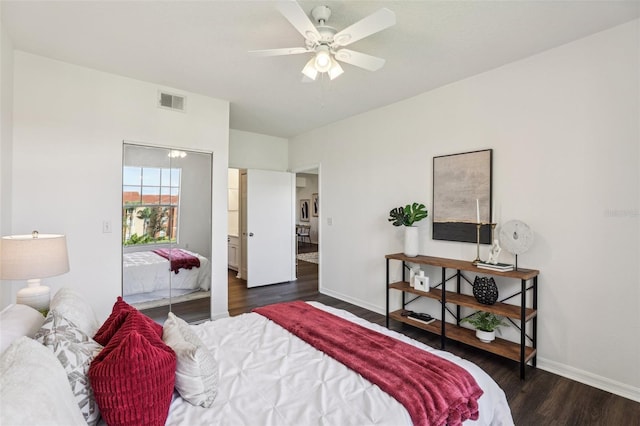 5530 Metrowest Blvd Unit 9-311, Orlando, FL 32811 - bedroom featuring dark wood finished floors, baseboards, a closet, and ceiling fan