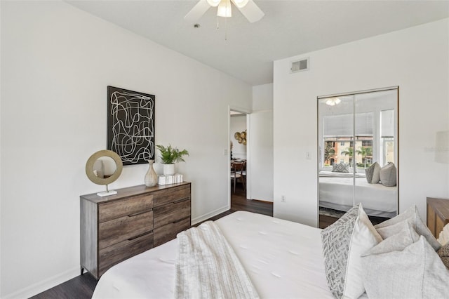 5530 Metrowest Blvd Unit 9-311, Orlando, FL 32811 - bedroom with dark wood finished floors, baseboards, and ceiling fan
