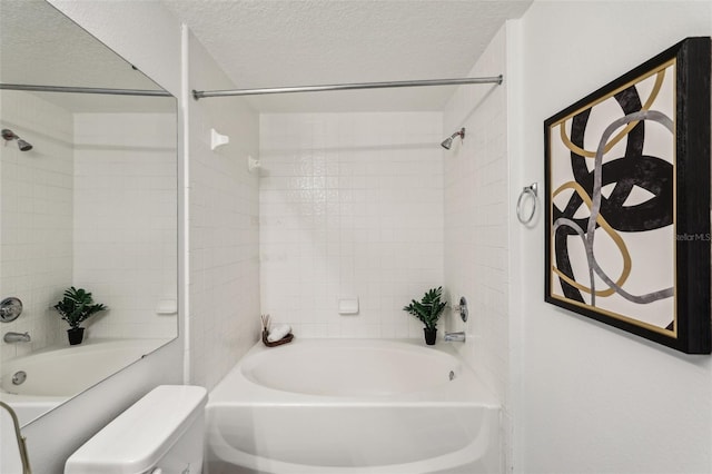 5530 Metrowest Blvd Unit 9-311, Orlando, FL 32811 - full bathroom with shower / tub combination, toilet, and a textured ceiling