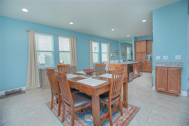 dining room featuring sink, wine cooler, and light tile patterned floors