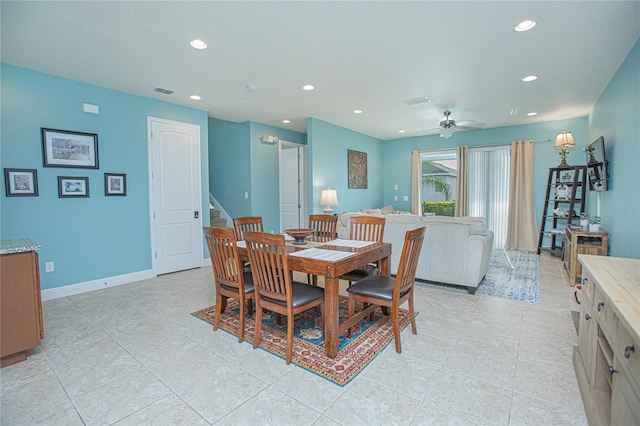 dining area with light tile patterned floors and ceiling fan