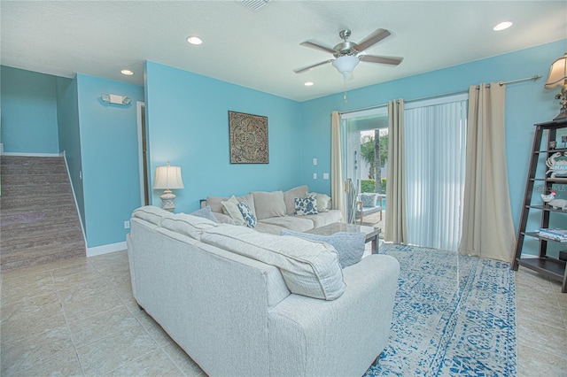 tiled living room with ceiling fan