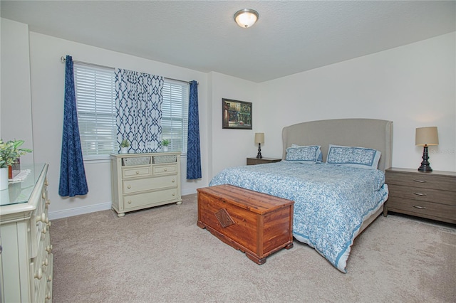 bedroom featuring light carpet