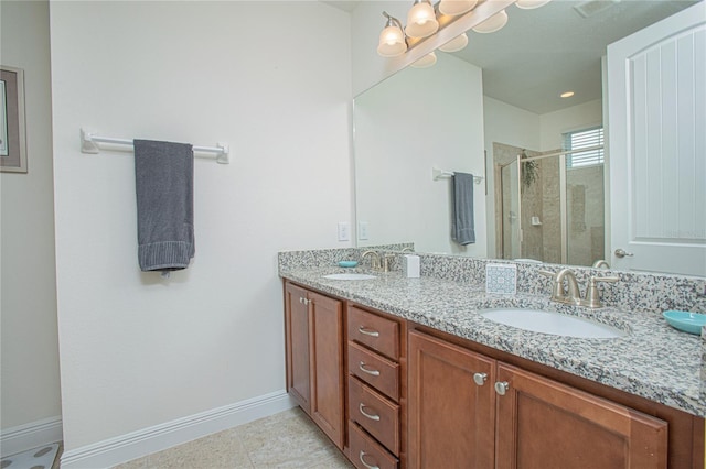 bathroom with double vanity, tile patterned flooring, and a shower with door