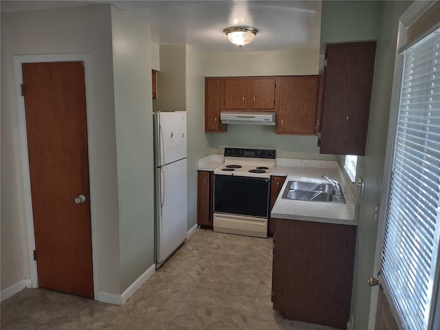 kitchen with sink and white appliances