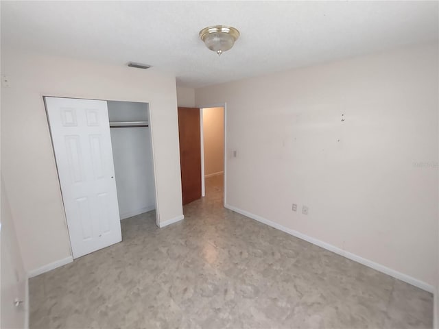 unfurnished bedroom with a closet