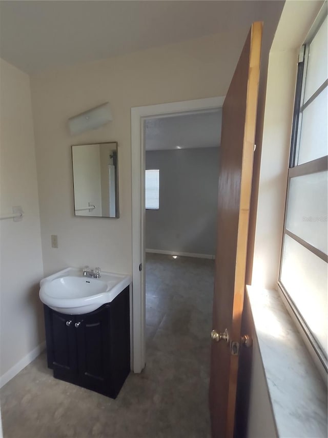 bathroom featuring vanity and plenty of natural light