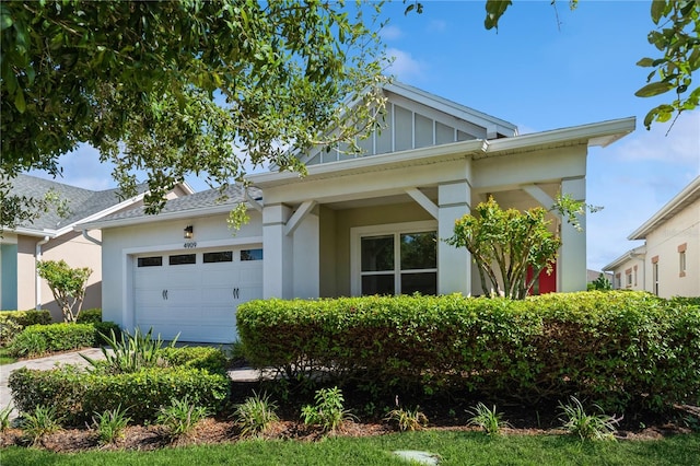 view of front facade featuring an attached garage and board and batten siding