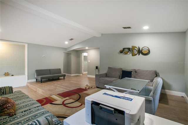 living area featuring visible vents, baseboards, light wood-style flooring, vaulted ceiling with beams, and recessed lighting