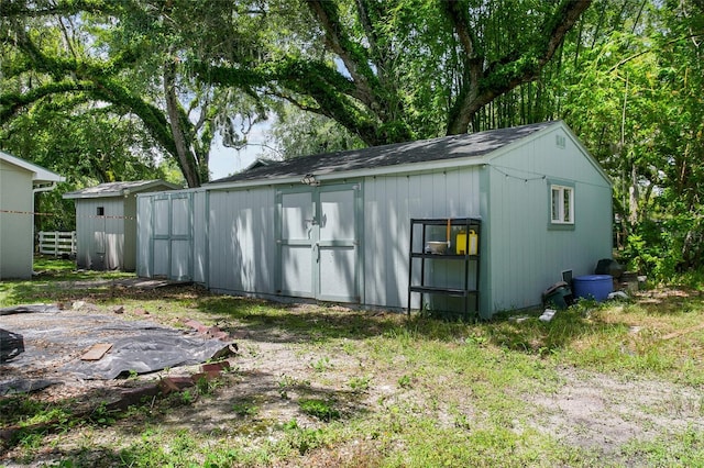 view of shed with fence