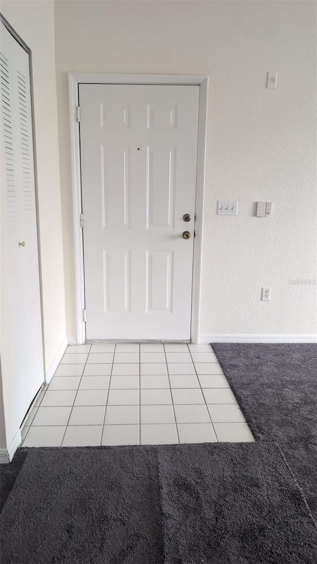 interior space featuring light tile patterned flooring