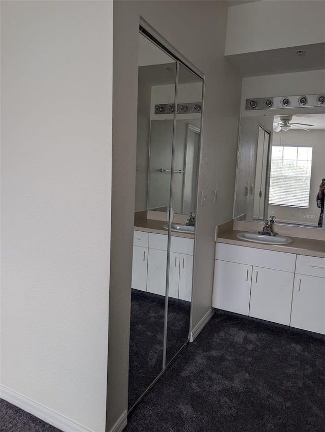 bathroom with vanity and ceiling fan