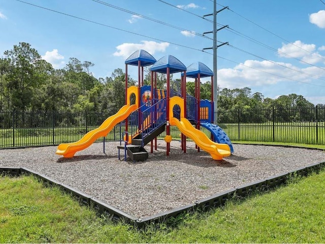 view of play area featuring a lawn