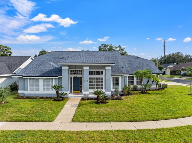 single story home featuring a front yard