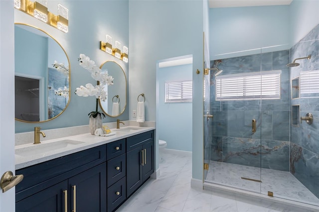 bathroom with an enclosed shower, toilet, dual bowl vanity, and tile patterned floors