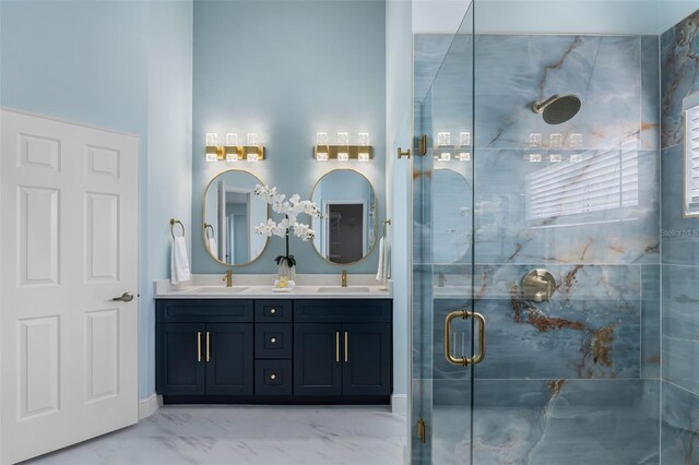 bathroom featuring a shower with shower door, tile patterned floors, and double vanity