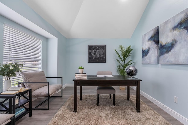 office featuring hardwood / wood-style flooring and vaulted ceiling