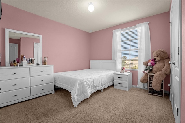 bedroom with light colored carpet