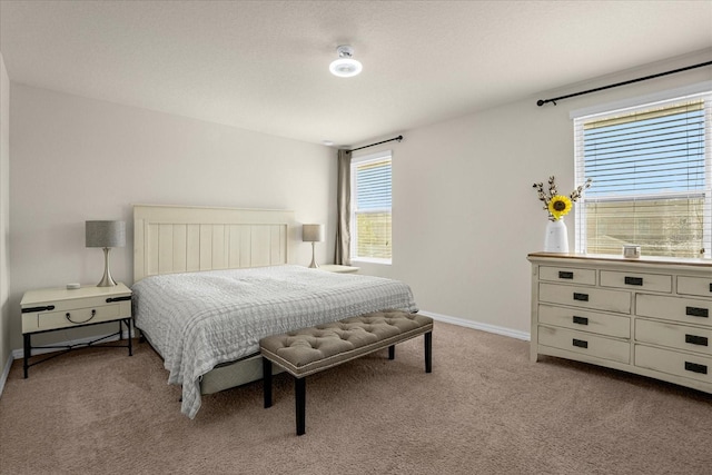 bedroom featuring light colored carpet