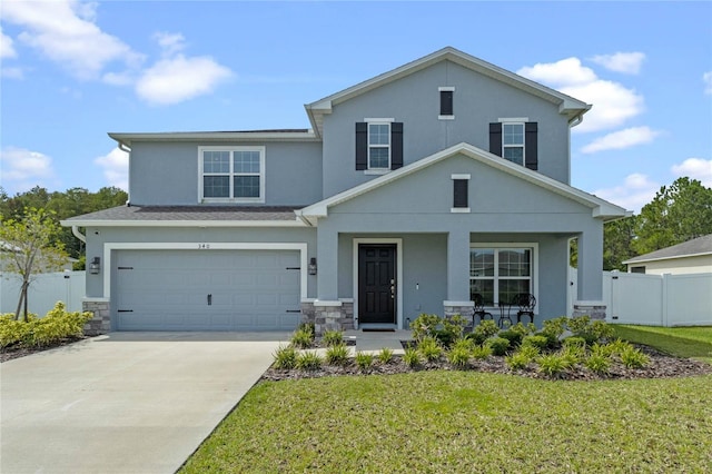 view of front of house with a garage and a front lawn