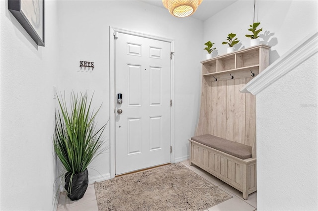 mudroom with light tile patterned floors