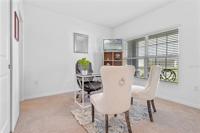 view of carpeted dining space