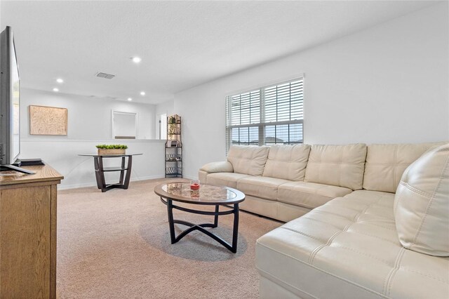 living room featuring light carpet