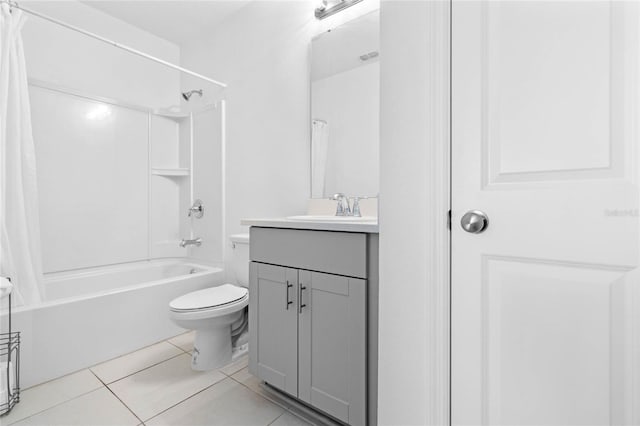 full bathroom featuring tile patterned floors, vanity, toilet, and shower / bath combo