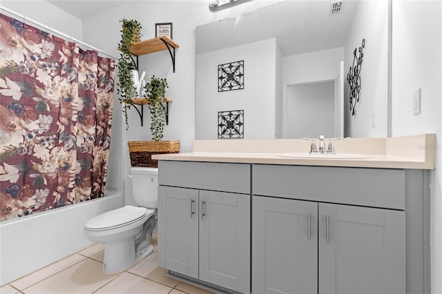 full bathroom with shower / bath combo with shower curtain, vanity, tile patterned floors, and toilet