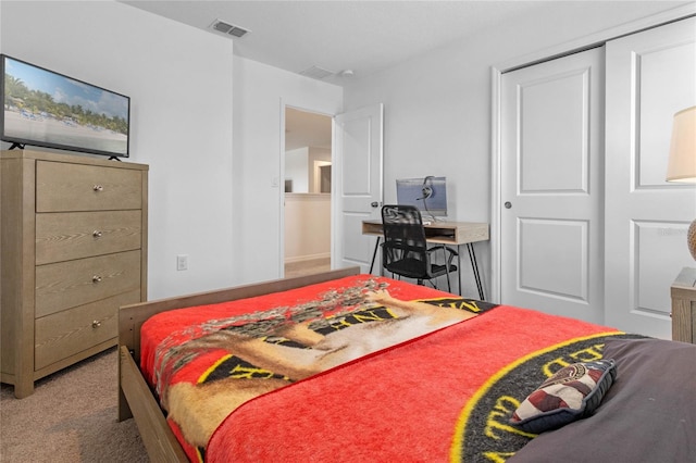 carpeted bedroom with a closet