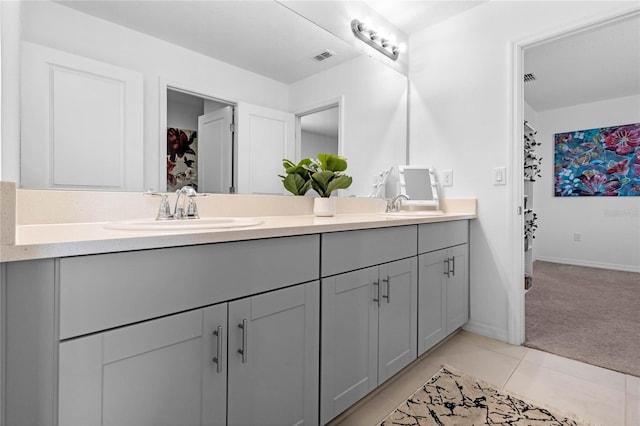 bathroom featuring double vanity and tile patterned floors