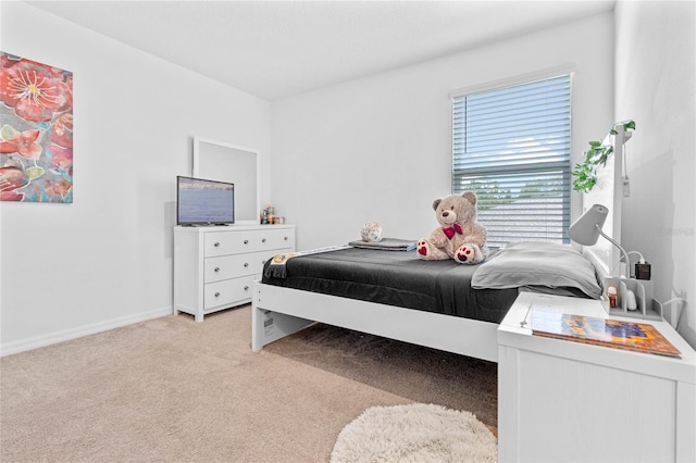 bedroom featuring light colored carpet