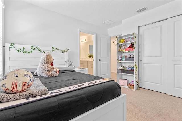 carpeted bedroom featuring a closet