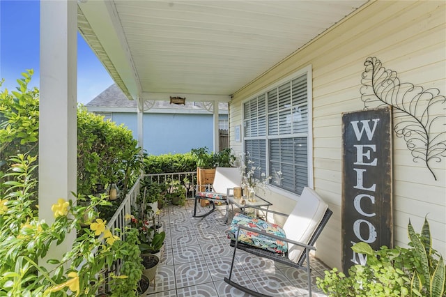 view of patio featuring a porch