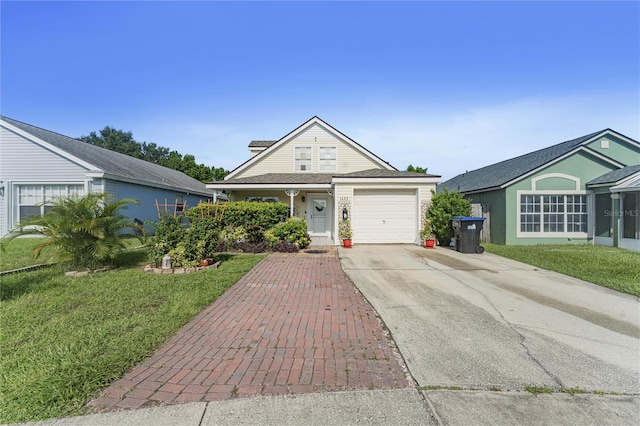 view of front of house featuring an attached garage, concrete driveway, and a front yard