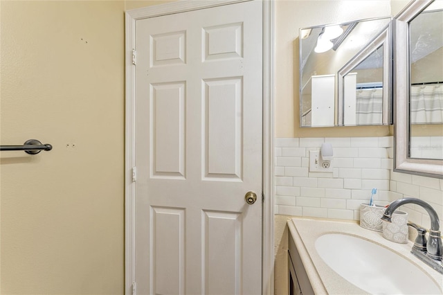 bathroom featuring backsplash and vanity