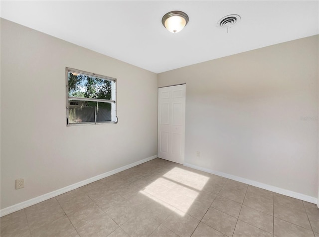 view of tiled spare room