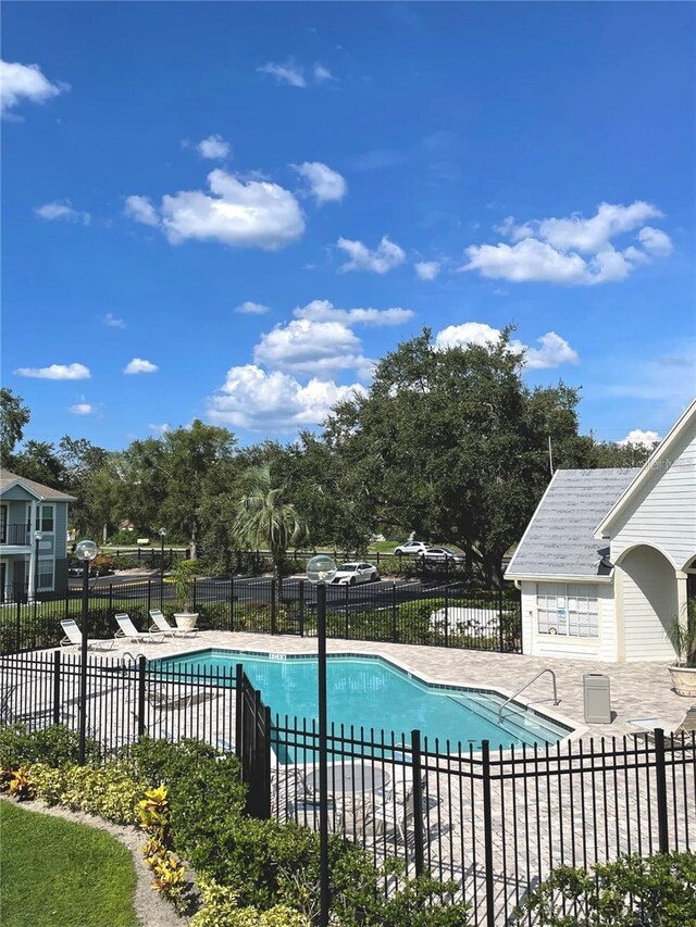 view of pool featuring a patio