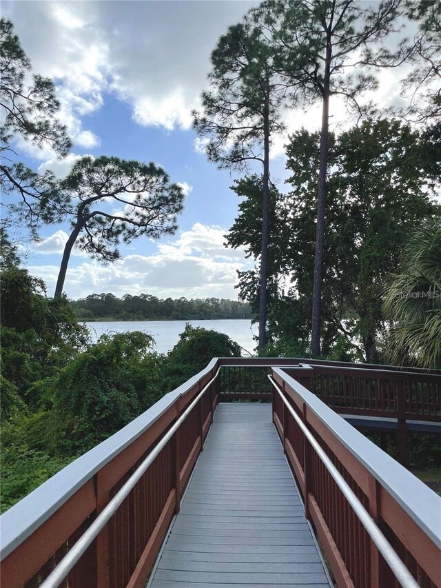 surrounding community featuring a water view