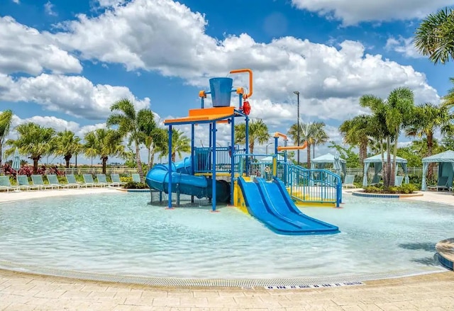 view of play area with a gazebo and a community pool