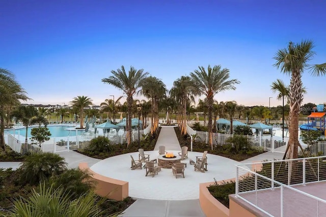 view of home's community featuring a patio and a pool