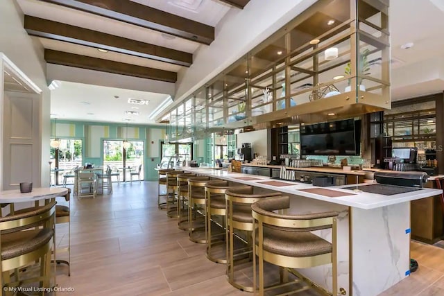 bar featuring beamed ceiling