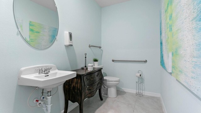 bathroom featuring toilet and tile patterned floors