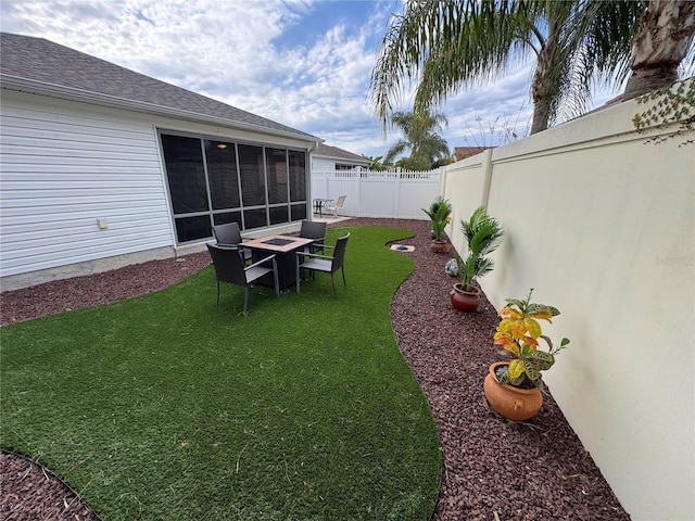 view of yard with a sunroom