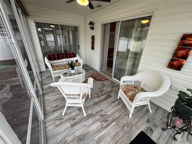 exterior space featuring ceiling fan