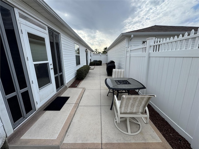 view of patio with a grill