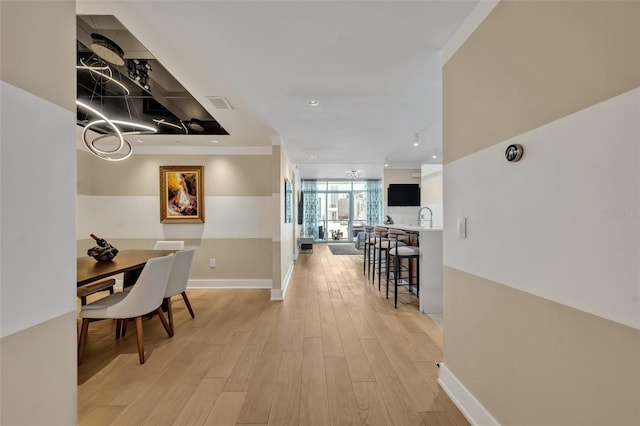 hallway featuring light hardwood / wood-style flooring