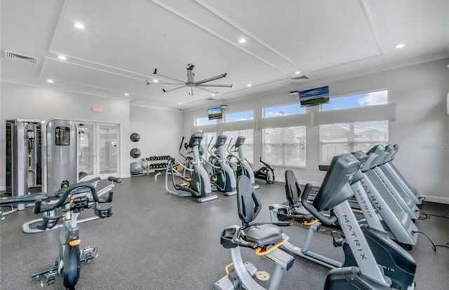 exercise room featuring ceiling fan, plenty of natural light, and crown molding