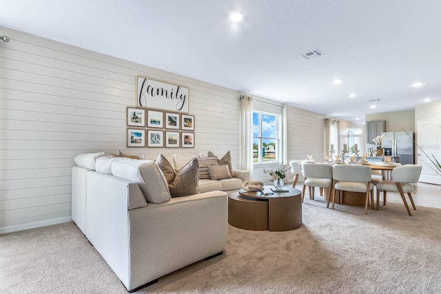 living room with light colored carpet